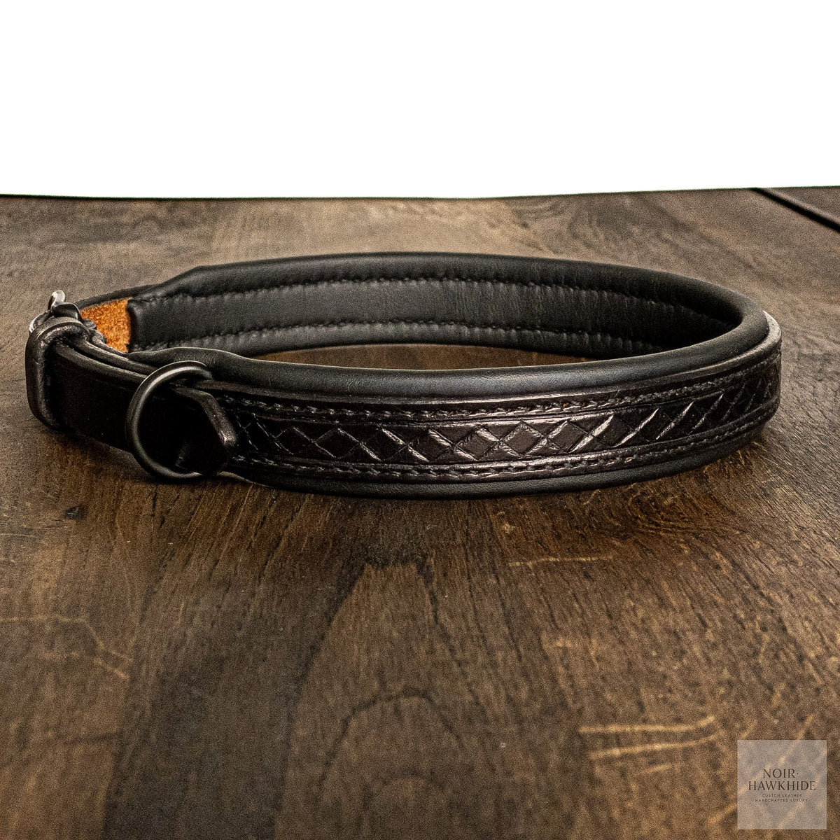 Close-up of handmade leather dog collar with Nordic pattern and mat black buckle