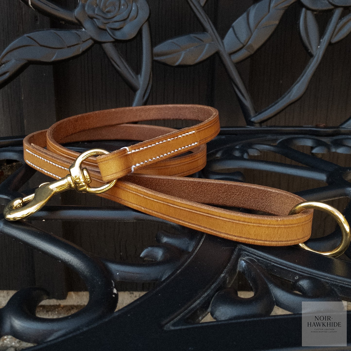 Leather dog leash handle with solid brass O-ring and hand stitching.