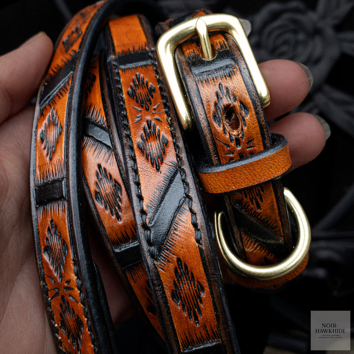 Close-up of handmade leather dog collar and leash set in Spanish Brown with geometric hand tooling and solid brass hardware