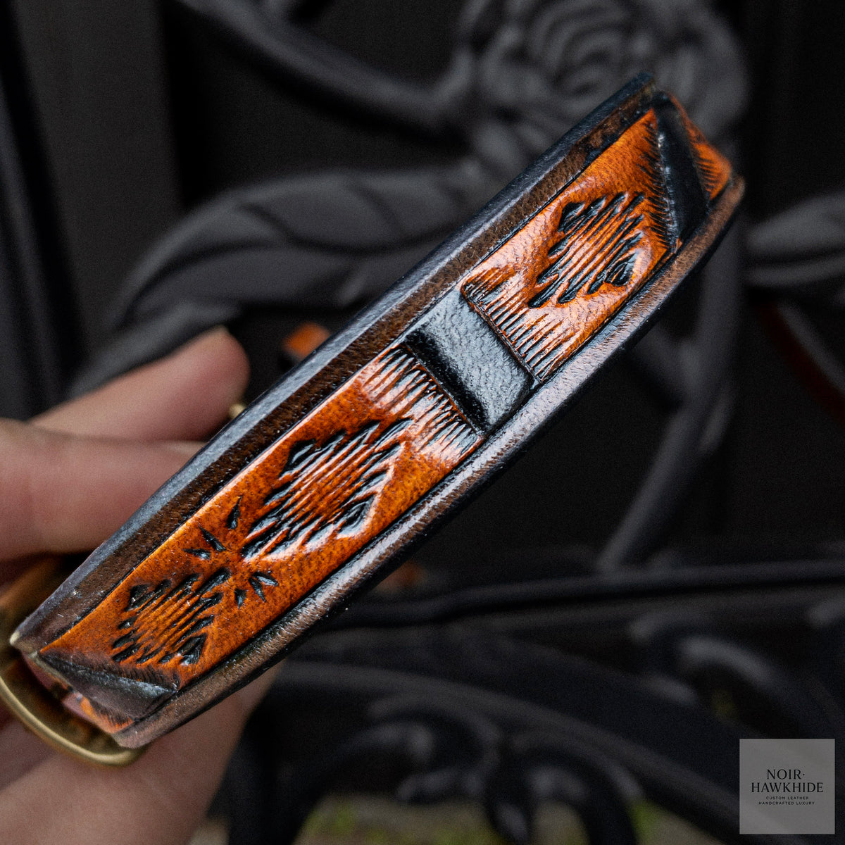 Close-up of Spanish Brown leather dog leash with hand-tooled Western geometric pattern and black details