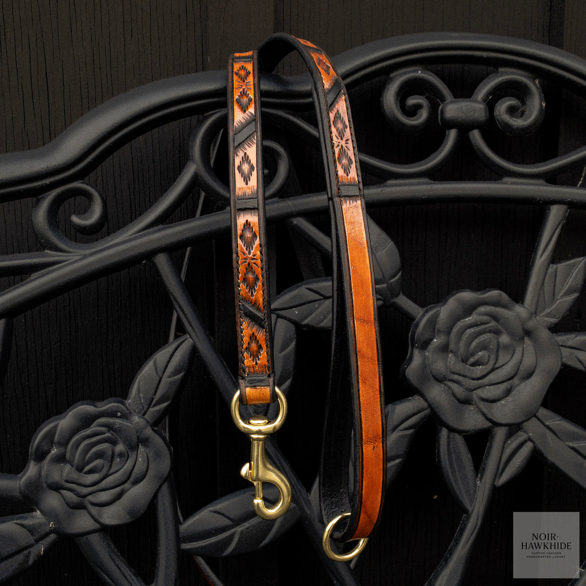 Full view of handmade Spanish Brown leather dog leash with Western geometric hand tooling, black edges and solid brass hardware