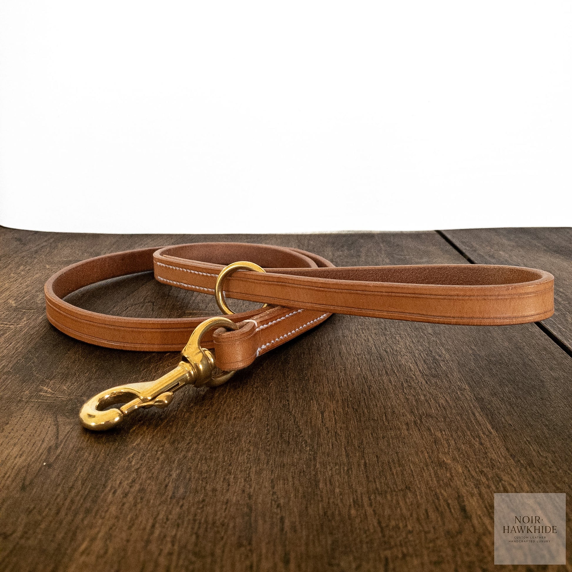 Full view of the handle on a handmade leather dog leash with solid brass O-ring.